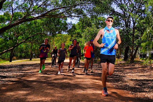 What heat? Friends support Rohan Martin Ritchie, in blue, running 100km on his 18th birthday.