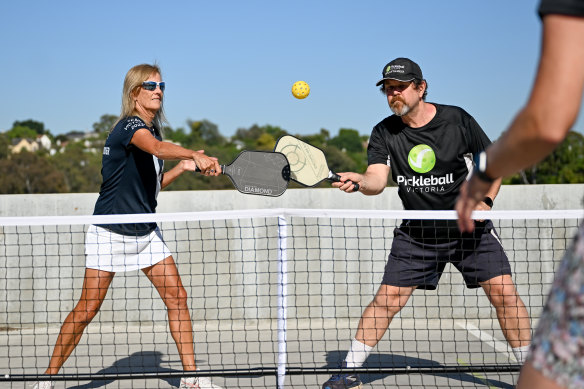 Julie Campbell and Mark Taylor play pickleball in Melbourne. The shrunken version of tennis, which also includes elements of badminton and ping pong, is the fastest growing sport in the US and rapidly on the rise in Australia. 