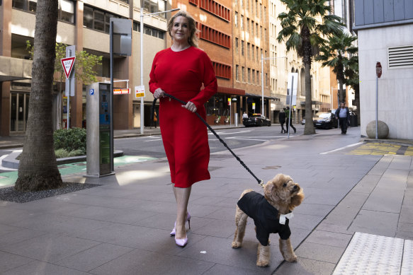 Gina Edwards and Oscar the cavoodle outside court before the judgment.