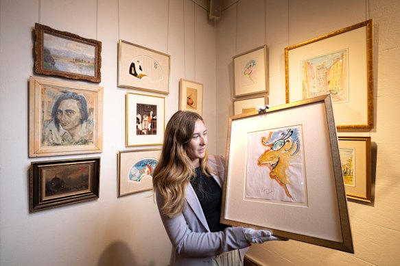 Madeleine Mackenzie, head of decorative arts and art at the Leonard Joel Sydney showroom, with some of the Barry Humphries collection.