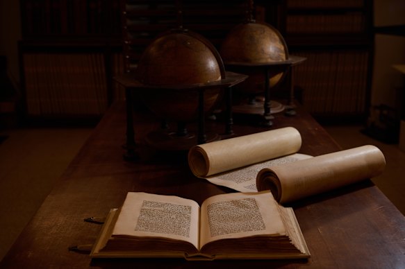 A centuries-old Torah scroll and Jewish scriptures at the library.