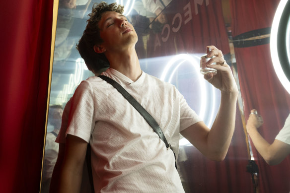 Singer Troye Sivan with the new fragrance from his lifestyle brand Tsu Lange Yor at Mecca’s Sydney flagship store.