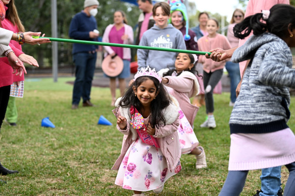 Tharnicaa Nadesalingam plays a game during her fifth birthday party in Biloela.