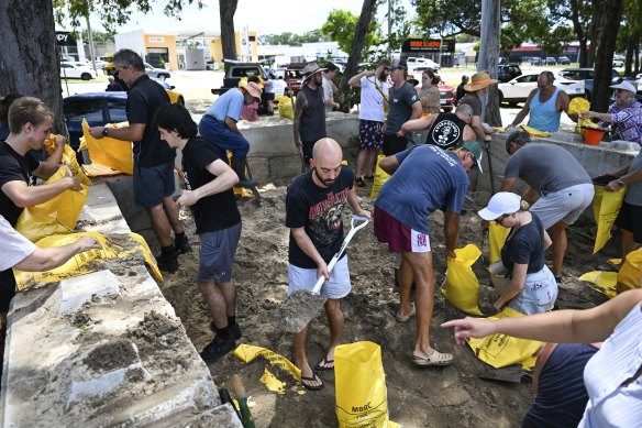 Residents collect sandbags from a council depot in Bribie Island.