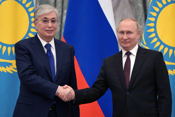 Kazakhstan’s President Kassym-Jomart Tokayev and Russia’s Vladimir Putin shake hands after talks in the Kremlin in February. Tokayev requested help from Russian troops to quell the January protests.