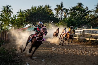 A horse race in Bima, on the Indonesian island of Sumbawa, where child jockeys are a longstanding tradition.