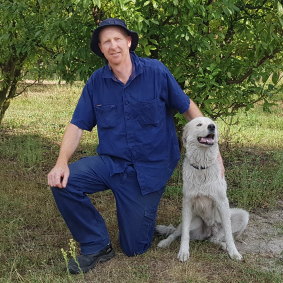 Farmer Brendon Dunn with his dog Christie.