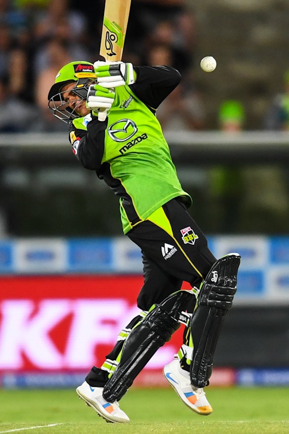 Evasive: Usman Khawaja struggles to cope with a high-pitched delivery.