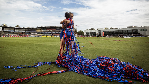 Brooke Lochland and captain Ellie Blackburn celebrate.