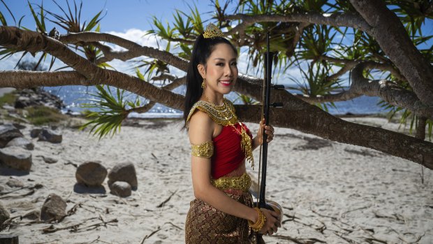 Brisbane-based composer Peranya Visitchantaragoon is photographed with a traditional Thai violin in Brisbane, March 14, 2025. Ms Visitchantaragoon helped create the controversial new theme song for season three of The White Lotus.