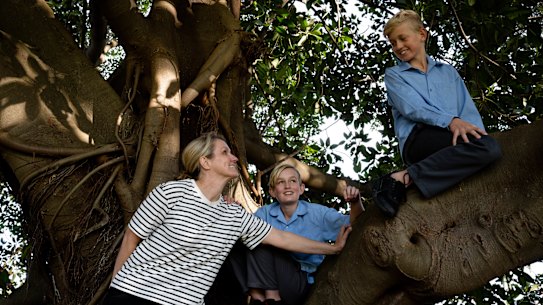 Kristin Rusznyak, with her twin boys, Luka Zak, will choose to send her children to a co-educational public high school to avoid private school costs.