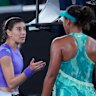 Sorana Cirstea, left, of Romania confronts Naomi Osaka, right, of Japan after their match.