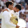 Carlos Alcaraz with the spoils of his Wimbledon victory over Novak Djokovic last year.