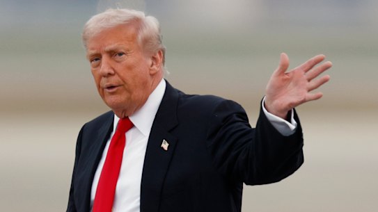 Donald Trump after landing in Air Force One on the weekend. The US president has threatened to sue the BBC over an edited video of him.