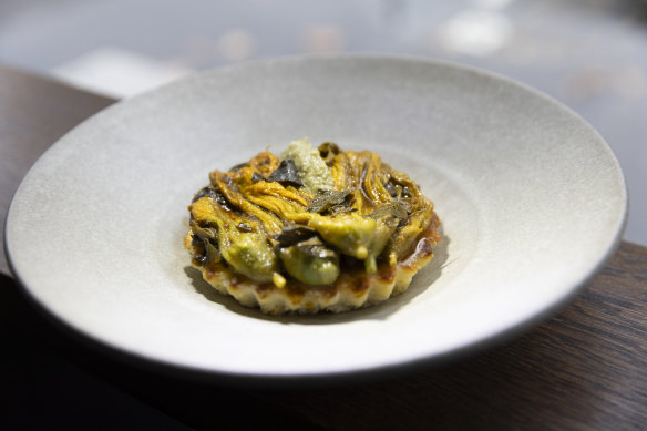 Braised zucchini flowers with warm ricotta.