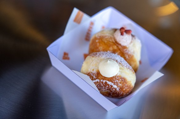 Boston cream and strawberry cream doughnuts. 