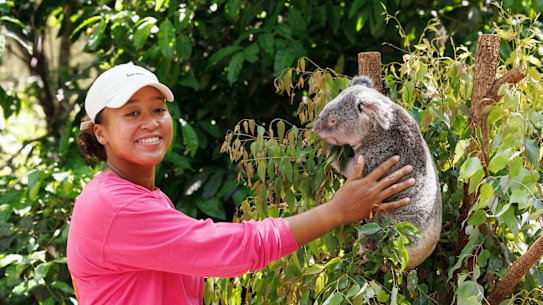 Naomi Osaka poses with Milton the koala at the Lone Pine Koala Sanctuary. 
