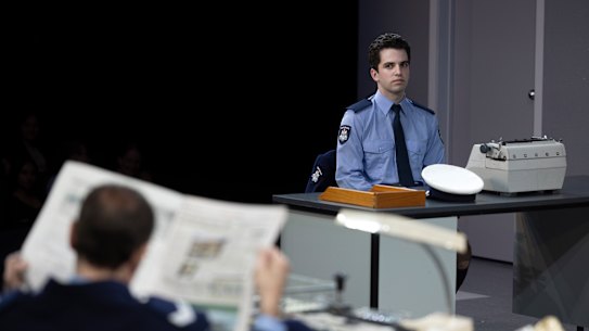 William McKenna looking at Steve Mouzakis in a scene from The Removalists.