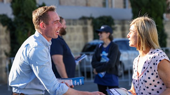 Liberal candidate for Curtin Tom White meeting candidates at the Claremont polling booth on Wednesday.