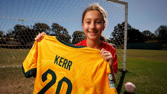 Zara Borcak at Old Bridge FC with the jersey given to her by Sam Kerr at the Australia vs France match in Brisbane on Saturday.