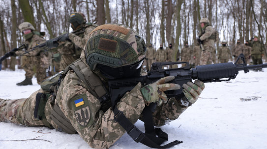 Civilian participants in a Kyiv Territorial Defence unit train in a forest near Kyiv.