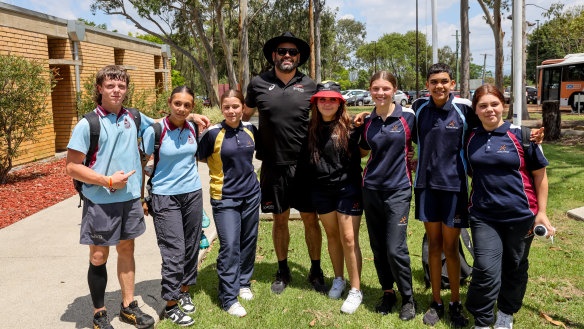Greg Inglis takes photos with kids attending a Goanna Academy day in Sydney’s west.