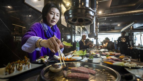 Jumee Lee cooks Korean BBQ for lunch at BBQ King on King street.