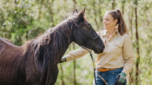 Sydneysider Cassandra Steppacher with her newly adopted brumby.