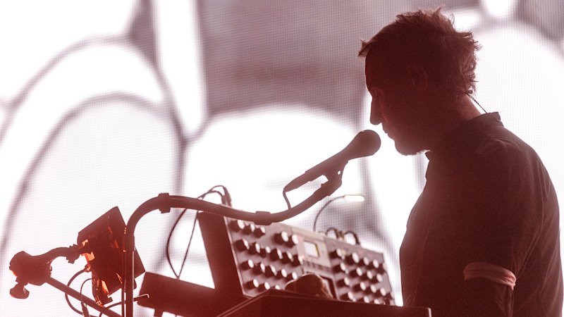 Massive Attack delivers critically praised live performance focused more on atmosphere than nostalgia