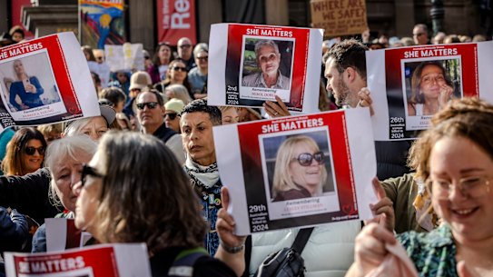 People holds signs at a National Rally Against Violence in Melbourne in 2024.