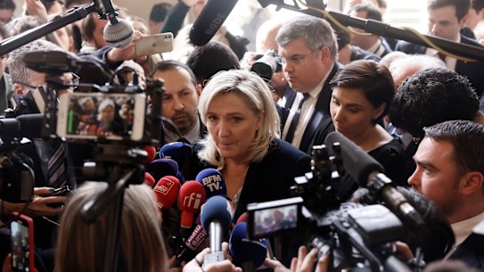 French far-right leader Marine Le Pen speaks to media at the National Assembly in Paris on Thursday.