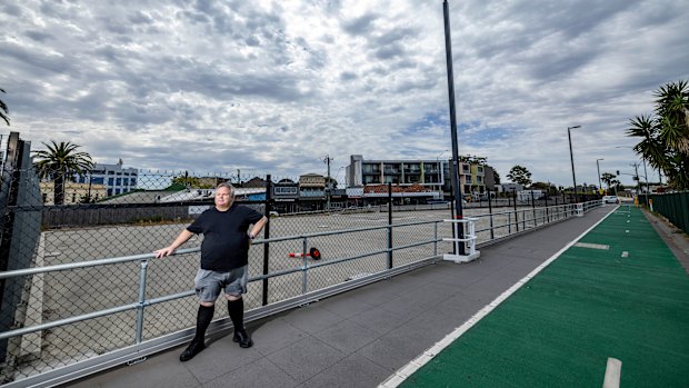 Derek Screen stands at one of the undeveloped concrete platforms built in Cheltenham when the level crossings were removed.