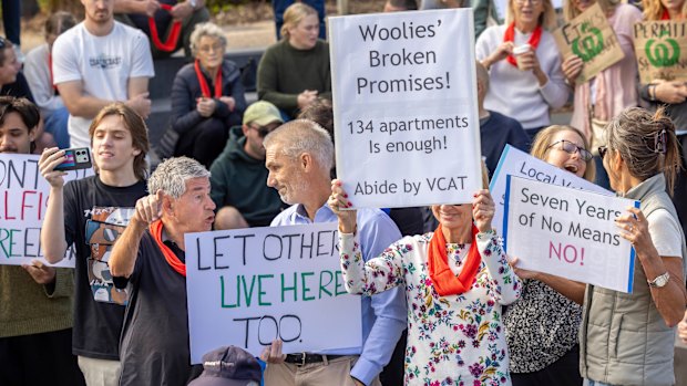 An anti-Woolworths development demonstrator confronts a YIMBY heckler at a community rally in Elsternwick.