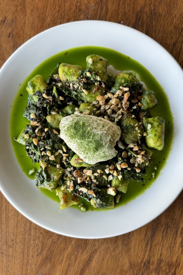 Ricotta gnudi with cavolo nero, hazelnuts and burned butter.