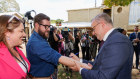 Prime Minister Anthony Albanese writes and signs ‘No Change To WA GST’ on the forearm of a West Australian reporter on Monday.