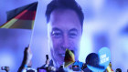 Elon Musk on screen at the rally.