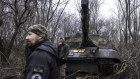 Ukrainian military mechanics work on a Soviet-era tank captured in the Donetsk region.
