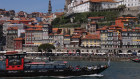 Tourist boats on the Douro River near the historic city centre of Porto.