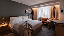 A corner room is often bigger and quieter. 