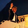 President Donald Trump boards Air Force One at Calgary International Airport.