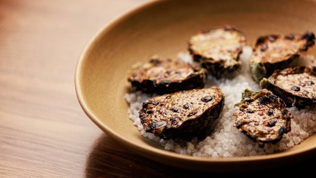 Oysters are baked in the style of rarebit, with a cheesy topping.