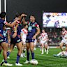 The Warriors celebrate a Te Maire Martin try against the Dragons on Saturday.