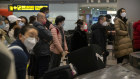 Open borders. Travellers wait for luggage in the international arrivals area at Beijing Capital International Airport.