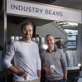 Industry Beans founders Steve (right) and Trevor Simmons with one of their MCG coffee carts.