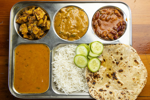 Create your own thali tray from the day’s 20 choices of curries.