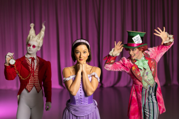 Benedicte Bemet as Alice, Jarryd Madden as the Mad Hatter, and Chengwu Guo as the White Rabbit in the Australian Ballet’s production of Alice in Wonderland.