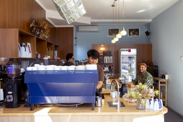 Mandeep Bhusal (seated) is serious about coffee.