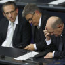 German Chancellor Olaf Scholz (right), Economy and Climate Action Minister Robert Habeck and German Finance Minister Joerg Kukies (left) attend debates before Scholz lost a vote of confidence at the Bundestag.