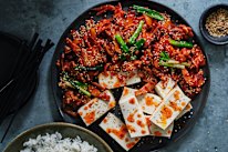 Stir-fried pork and kimchi with boiled tofu.