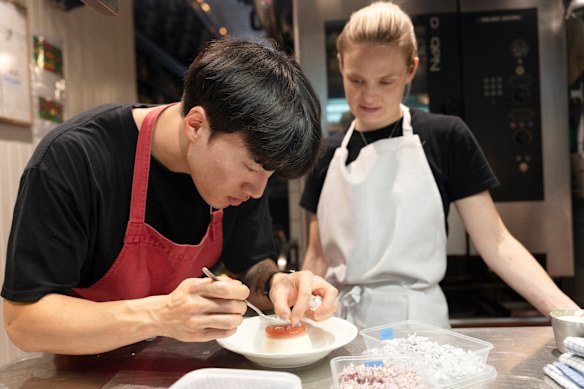 Henry Yung and Lauren Eldridge prepare the flower panna cotta.